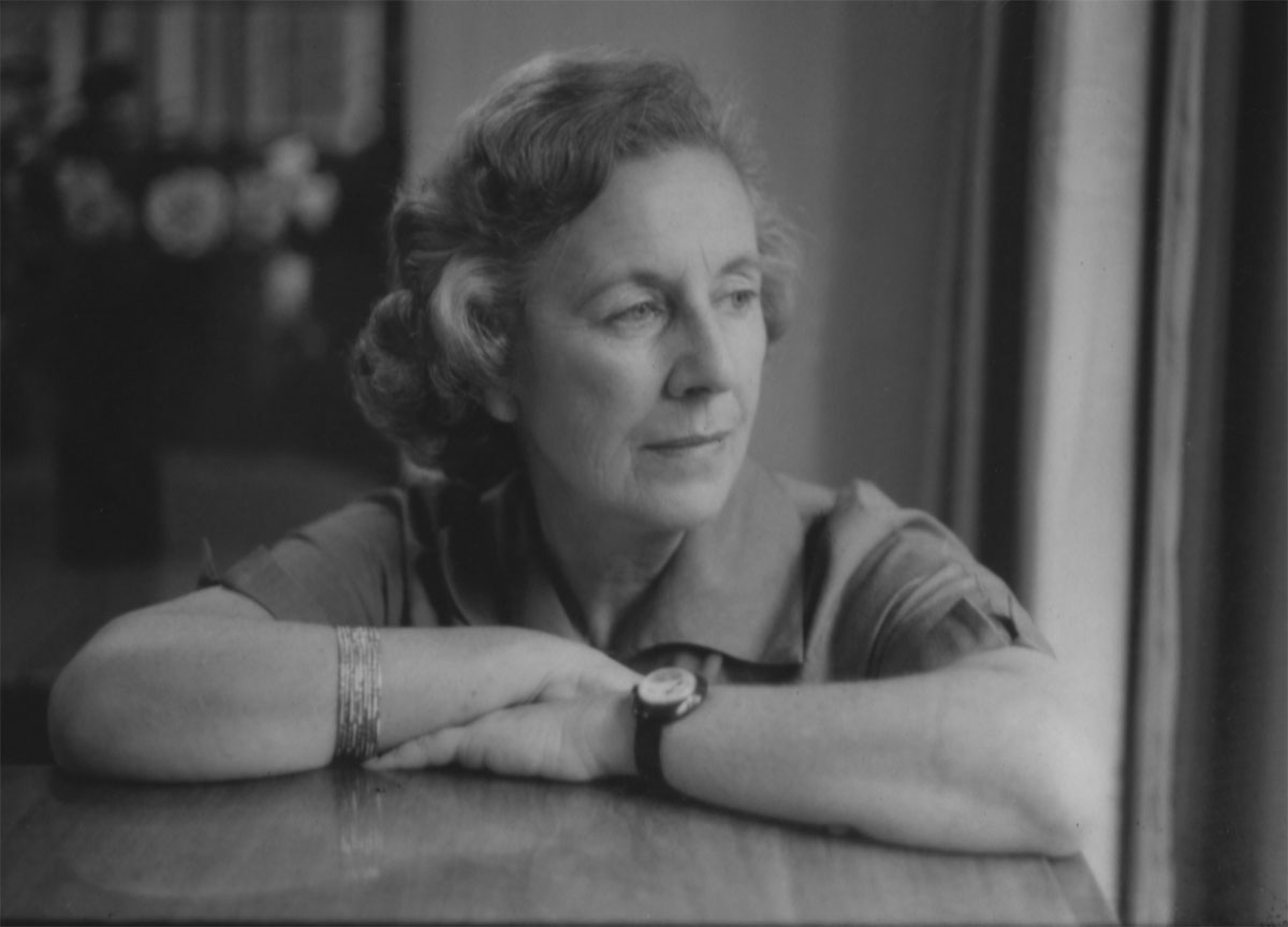 Black and white portrait of woman with arms crossed